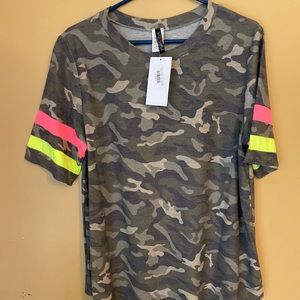 Cute feminine camo top with bright yellow and pink stripes on sleeve.